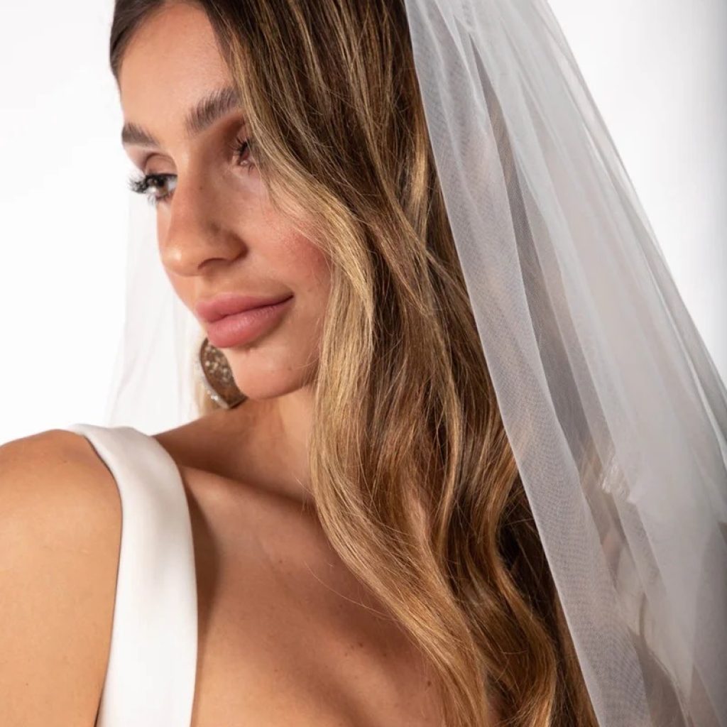 Elegant bridal gowns with delicate lace details Elegant bridal gowns with delicate lace details